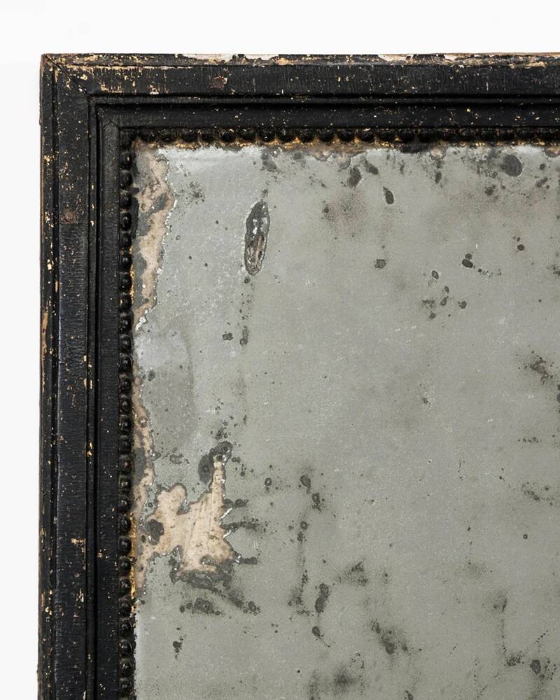 Antique French mirror from the late 19th century with a black painted frame.