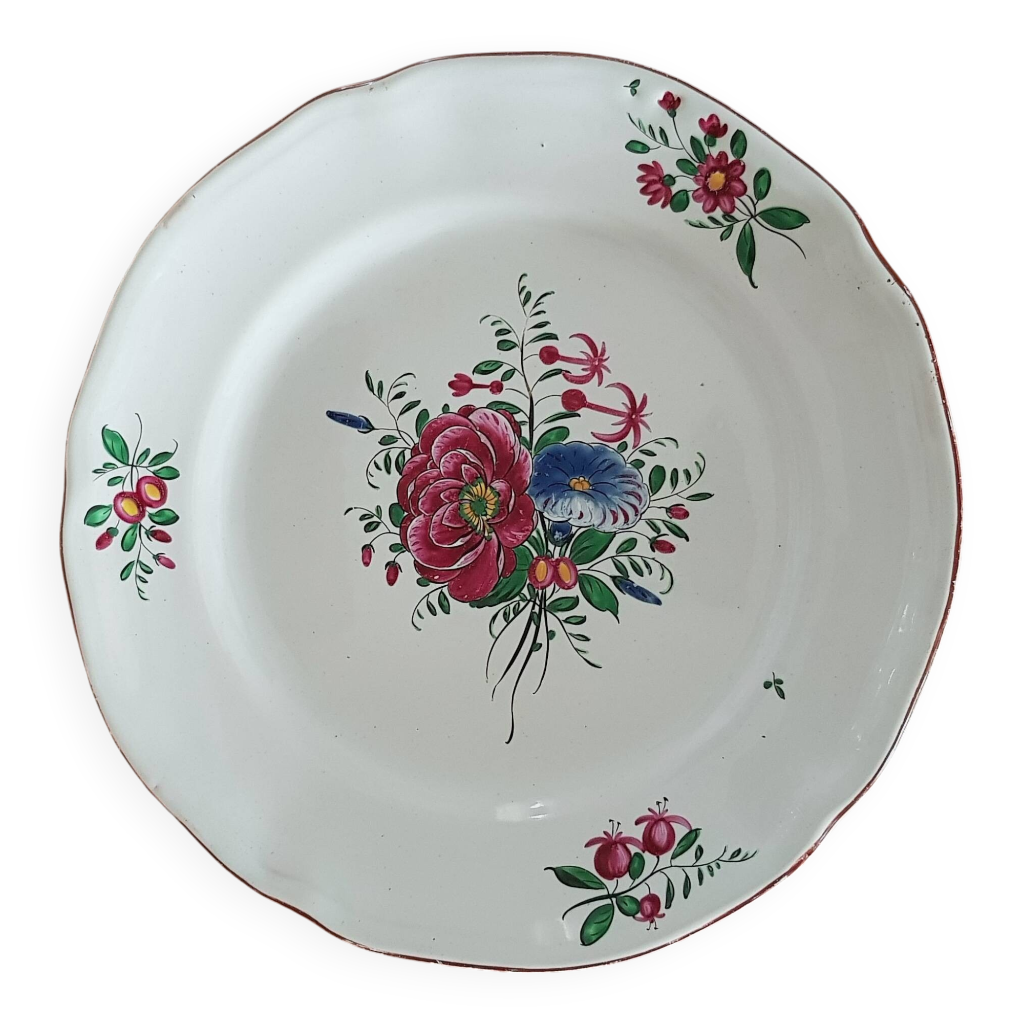 Old round earthenware dish from the East, floral motif