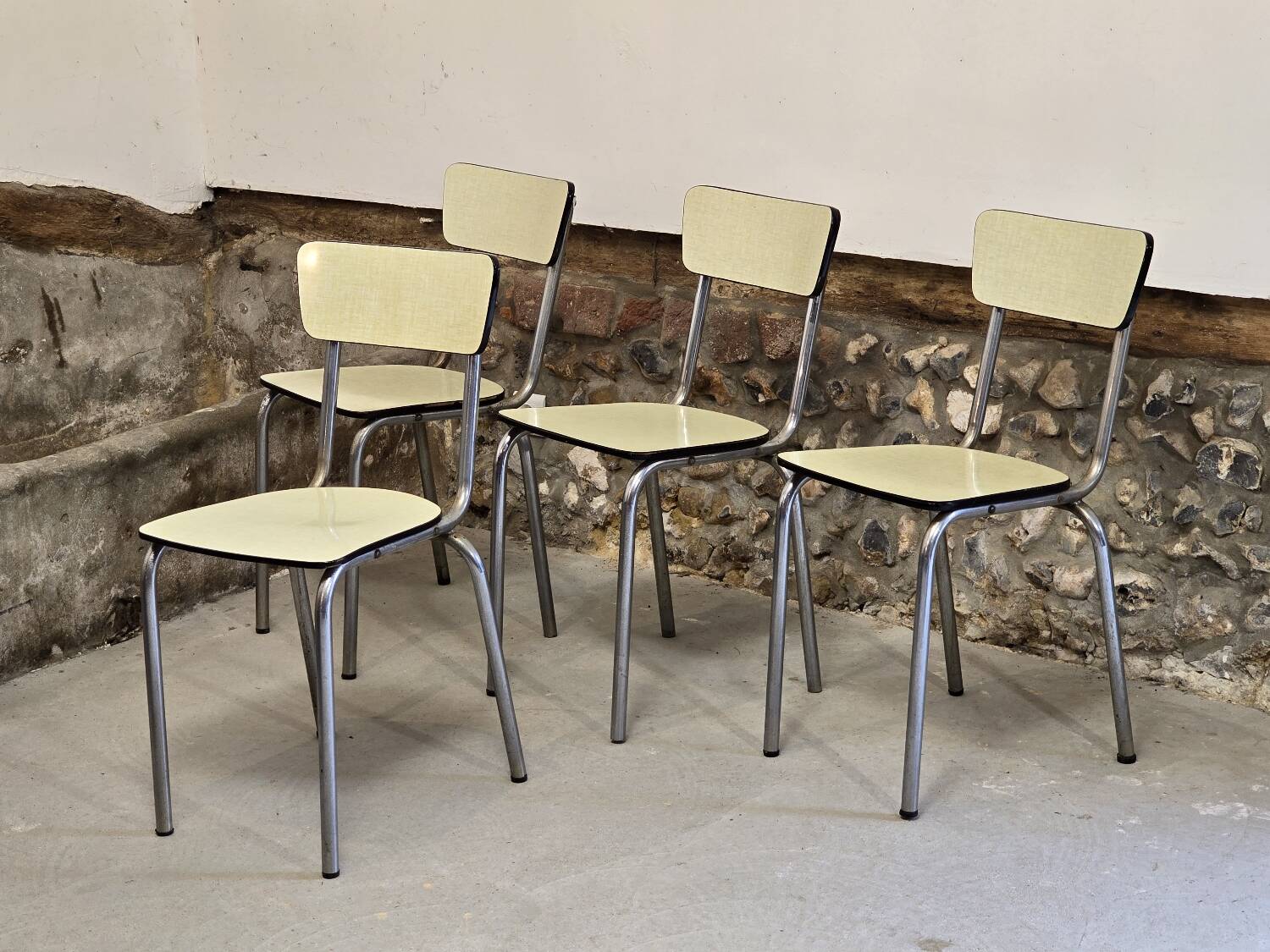 Set of 4 light yellow formica chairs