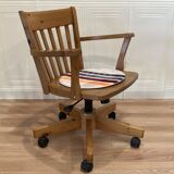 Solid wood swivel and reclining armchair.