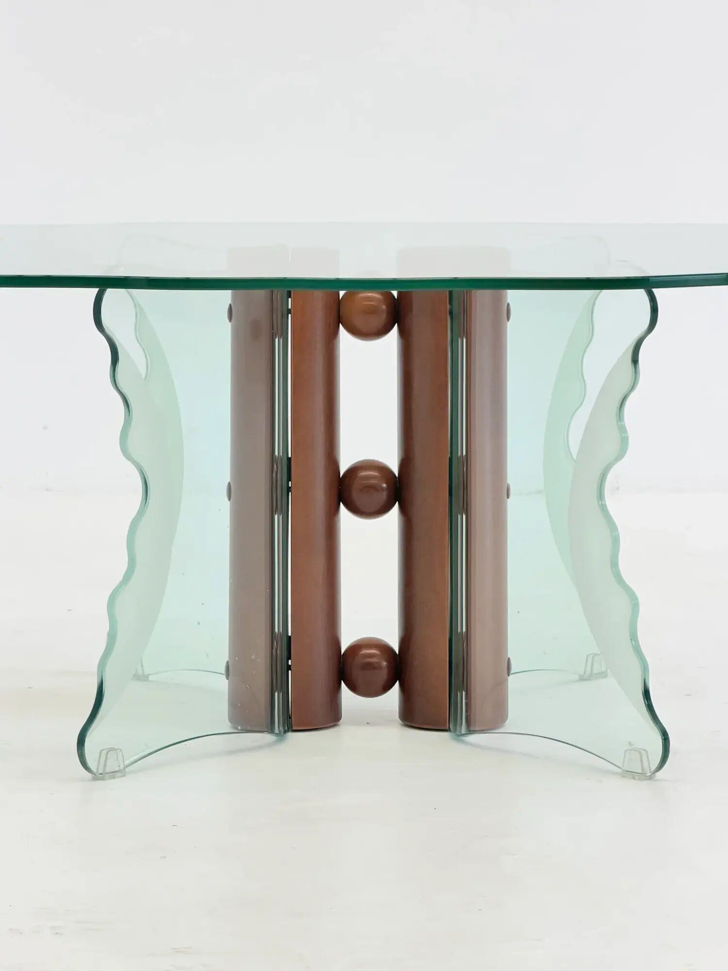 Vintage postmodern coffee table with wavy glass and wooden spheres