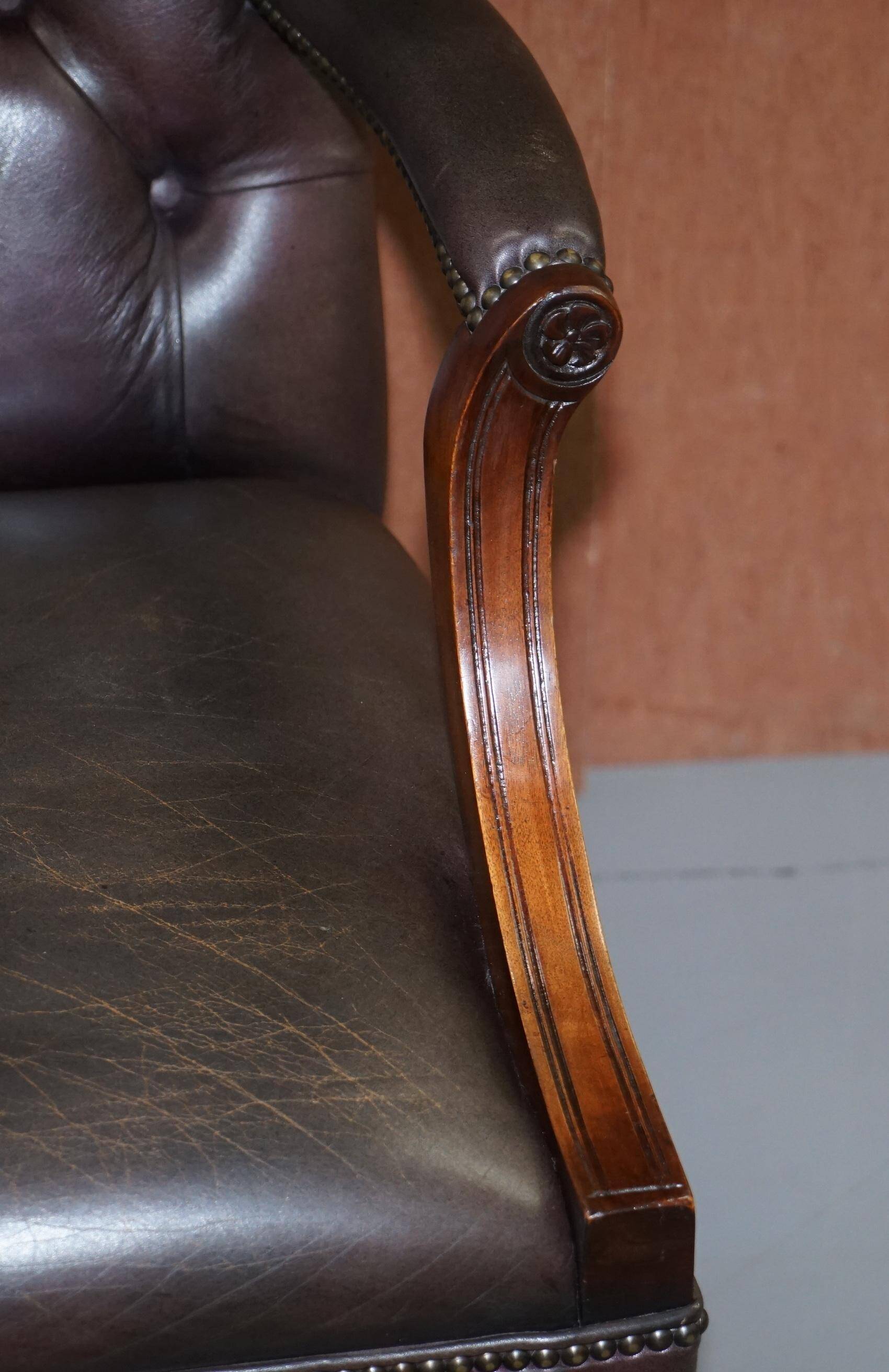 Gainsborough armchair George II leather Chesterfield hand-carved with claw and ball feet.