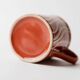 Vintage tea or coffee service in 1970s ceramic, teapot with lid and milk jug, rust orange with retro striped pattern, mid-century decoration, gift idea.