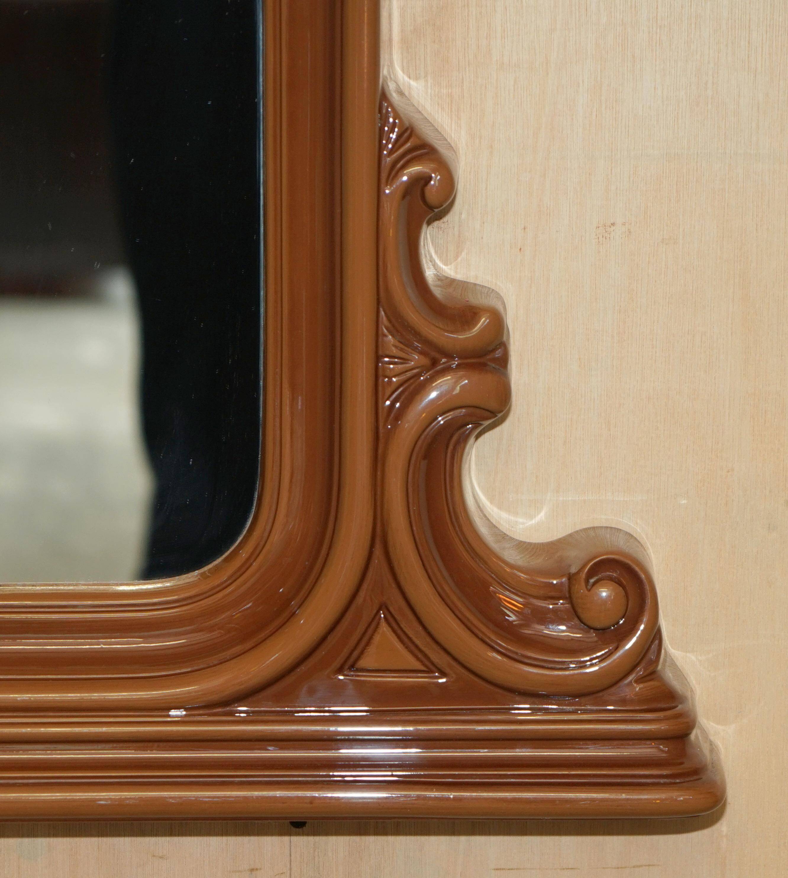 Vintage Art Deco decorative mirror with a thick frame.