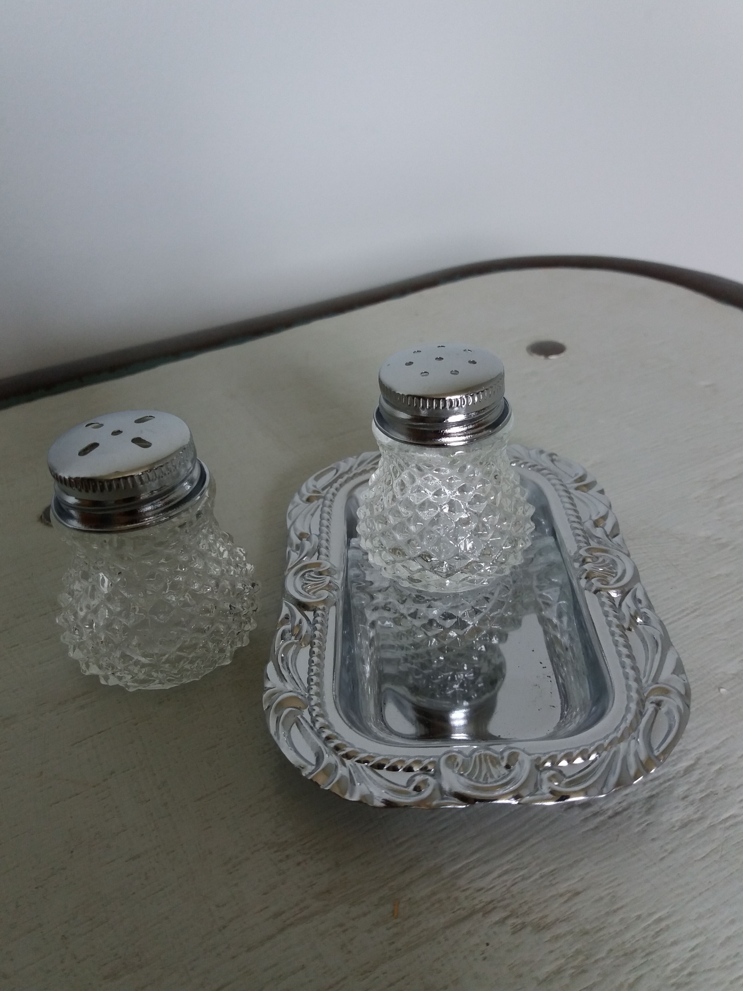 Salt shaker and pineapple shaped pepper