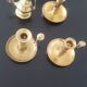 Many candlesticks and a small oil lamp.