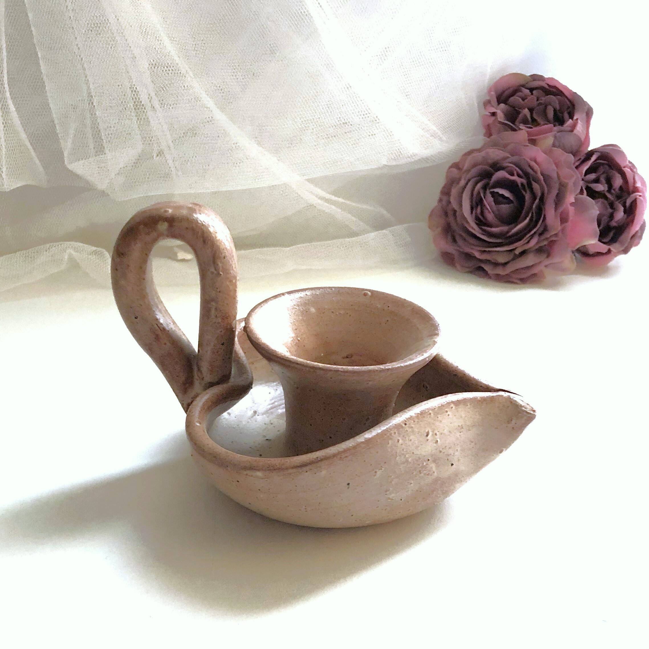 Glazed stoneware heart-shaped hand candle holder