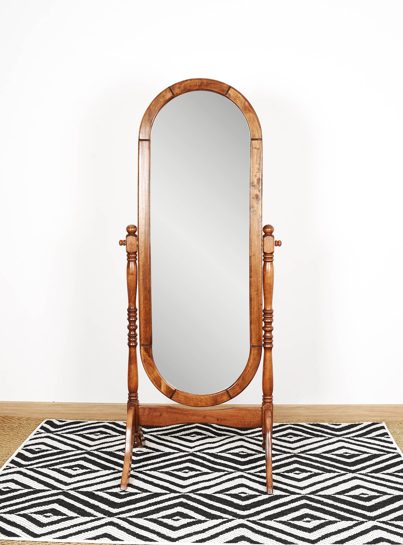 Large psychic mirror on legs with pivoting oval frame.