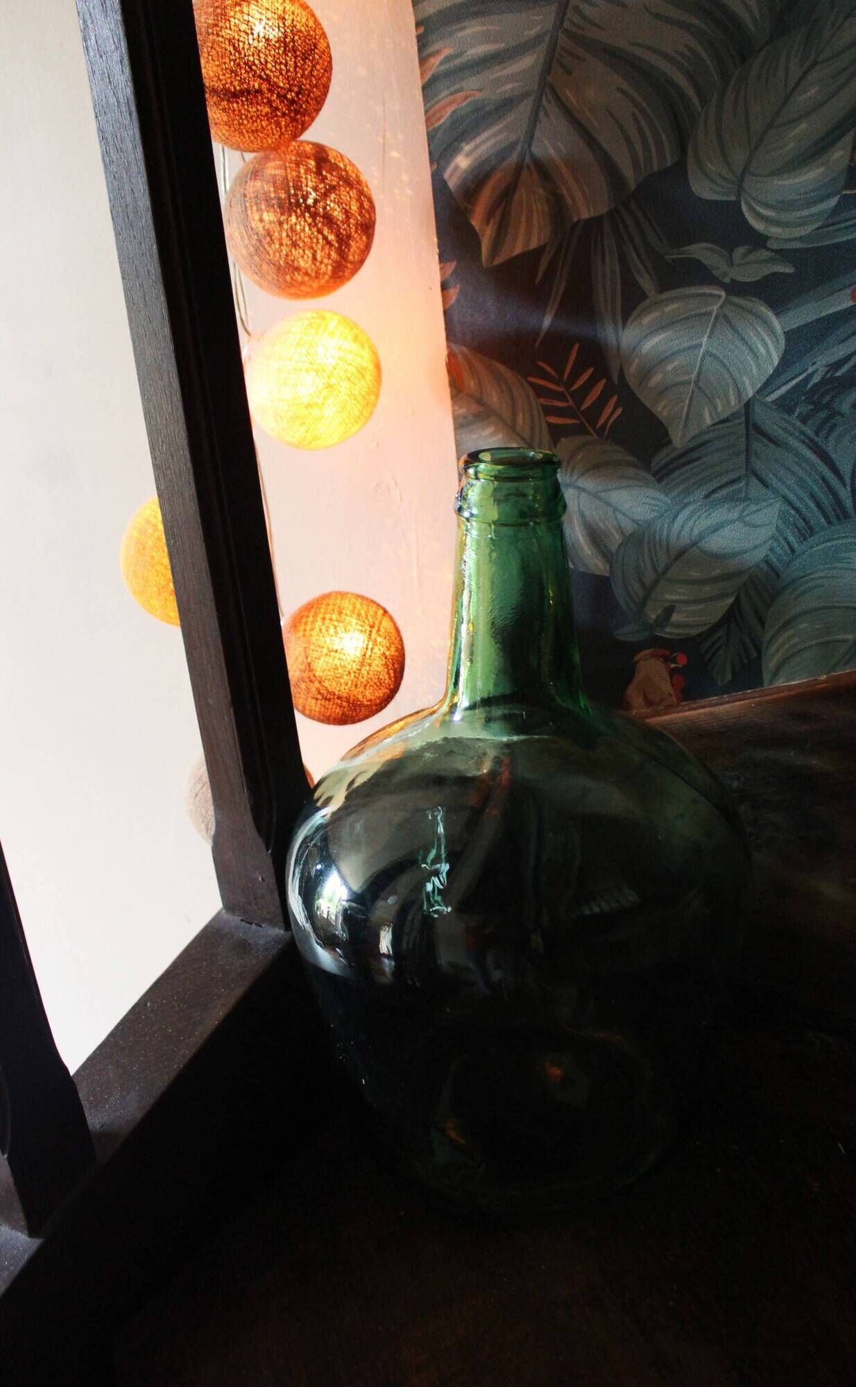 Dame Jeanne carboy from the Viresa collection in dark green glass