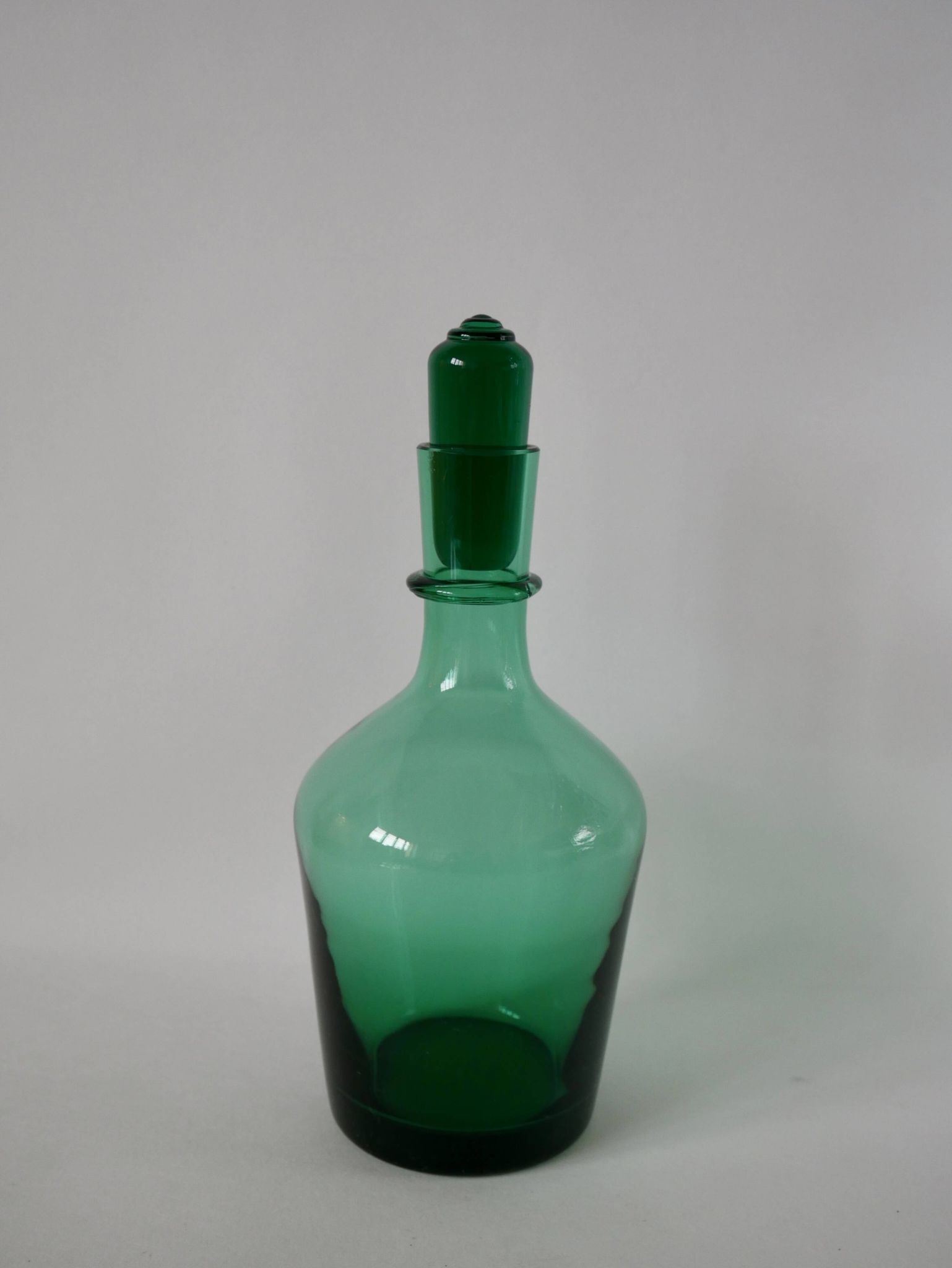 Set of a carafe and 4 designer glasses in green glass from the 70s