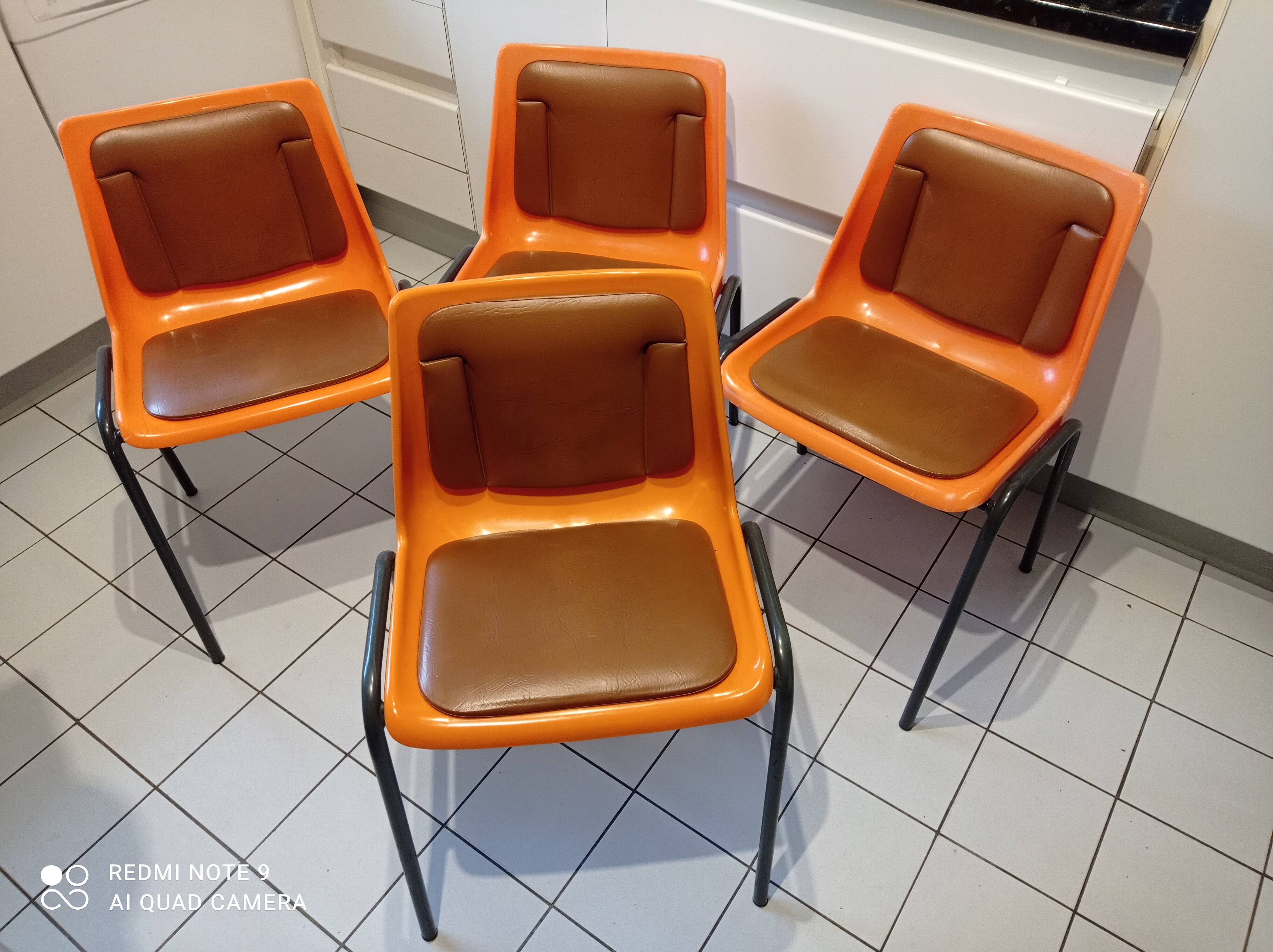 Chairs orange plastic shells seats and backrests imitation leather
