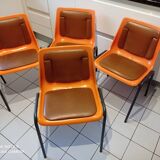 Chairs orange plastic shells seats and backrests imitation leather
