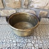 Basin cauldron or old garden in yellow copper