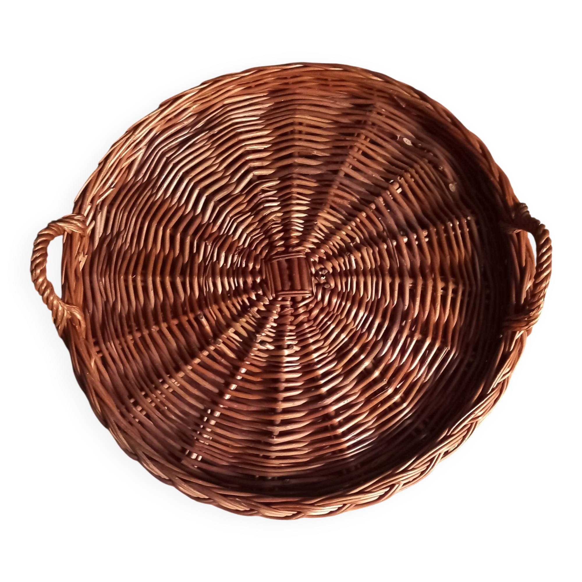 Large round dark wicker tray with two handles.