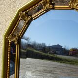 Hall mirror, gilded frame with fillets and fleur-de-lis.
