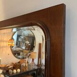 Beveled mirror with wooden contours
