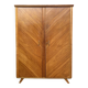 Mid-century wardrobe from the 1960s in wood, with a chevron front and tapered legs.