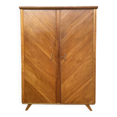 Mid-century wardrobe from the 1960s in wood, with a chevron front and tapered legs.