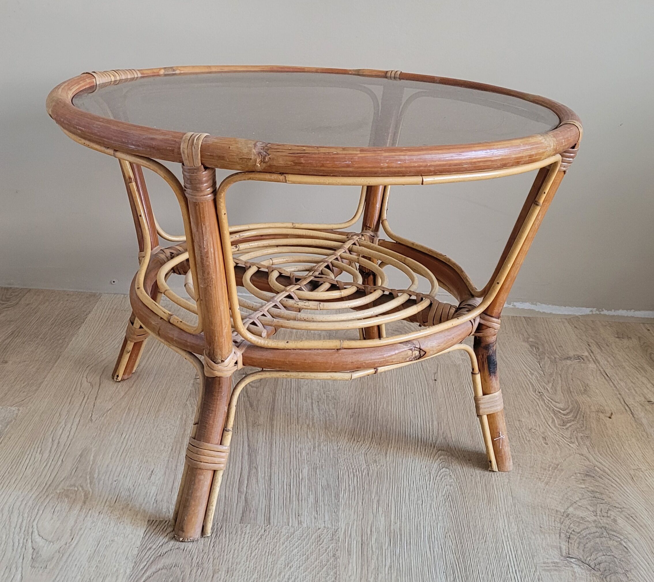 Light rattan lounge table and smoked glass