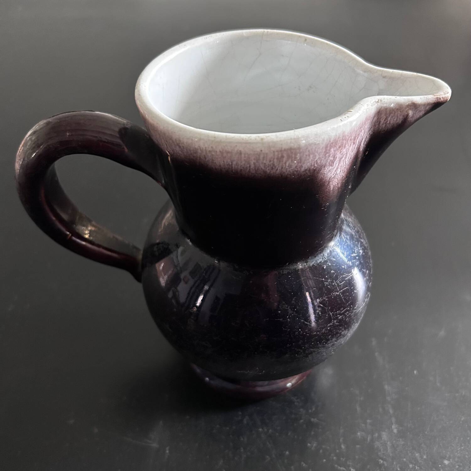 Antique tilted pitcher