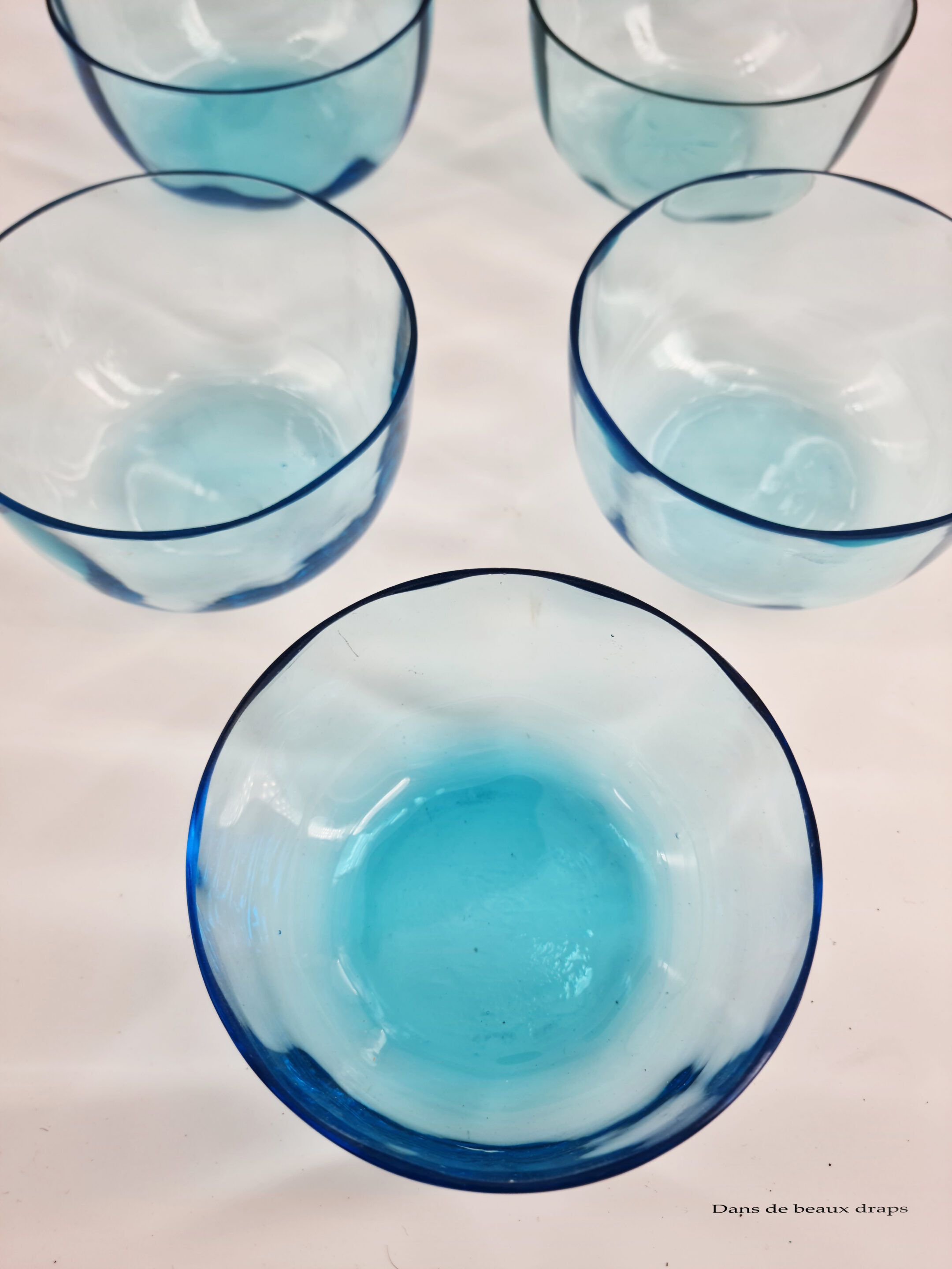 Suite of 9 cups in pale blue crystal, XIX th
