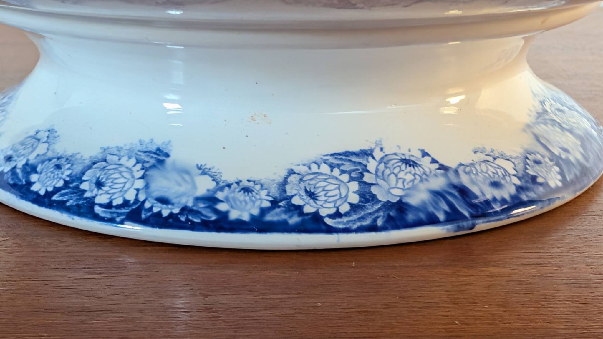 Antique compote dish with blue floral decoration.