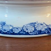 Antique compote dish with blue floral decoration.