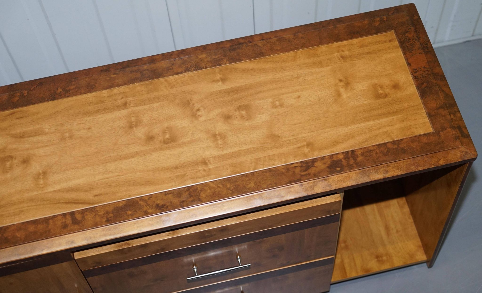 Walnut Burr buffet with drawers and wheels, part of a set.