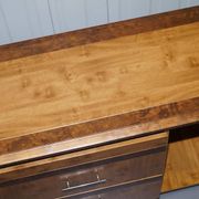 Walnut Burr buffet with drawers and wheels, part of a set.