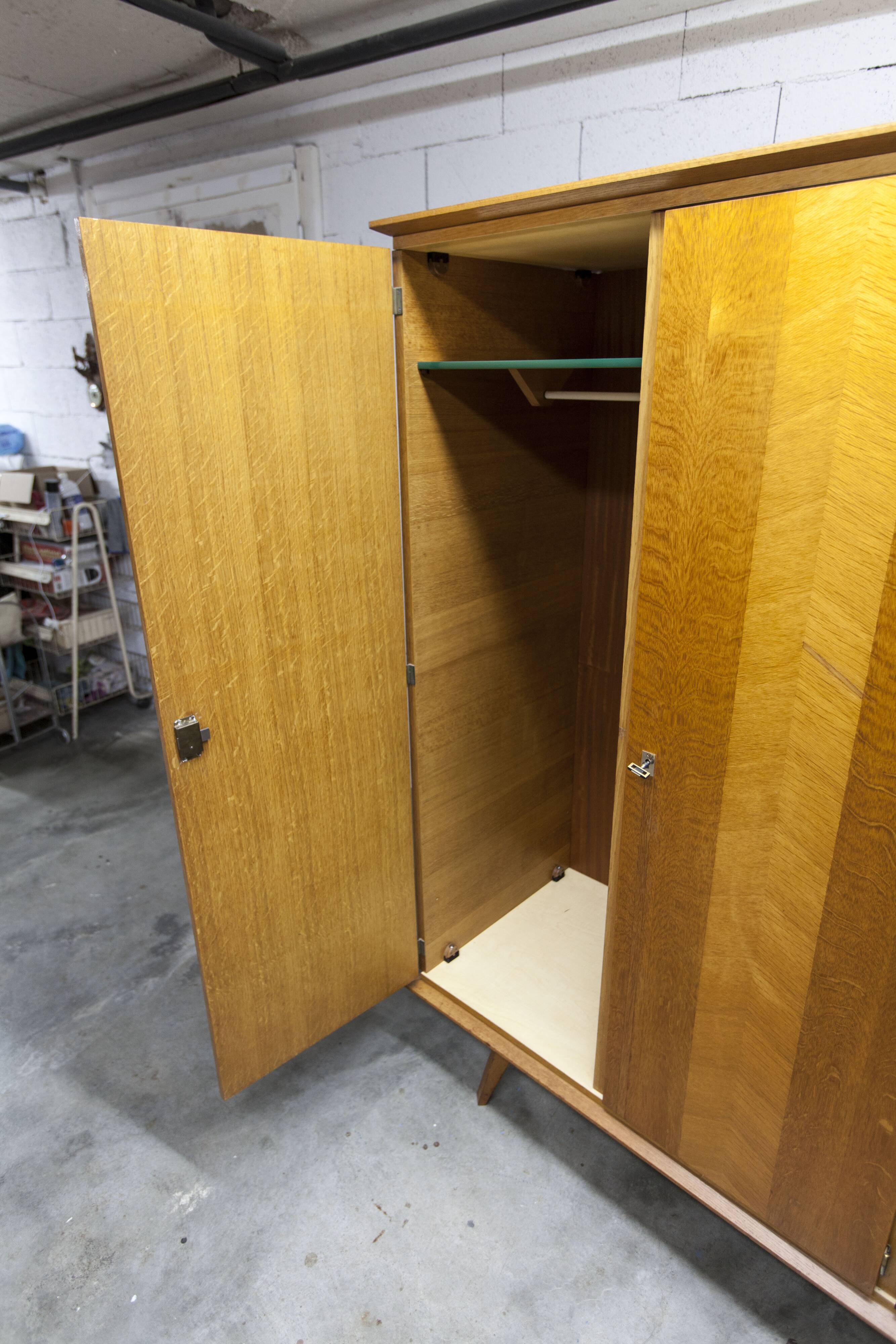French wardrobe with tapered legs, 3 doors, 1 mirror (27*130), and 1 drawer.