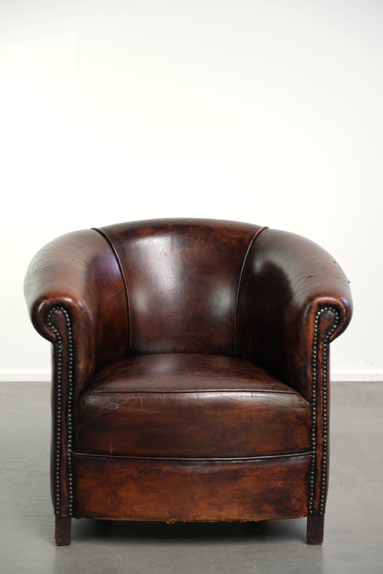 Vintage sheepskin club armchair with beautiful colours and a subtle size