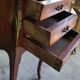 Pair of rosewood bedside tables with marble top