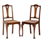 Pair of antique English chairs in hardwood with lion paw carved legs.
