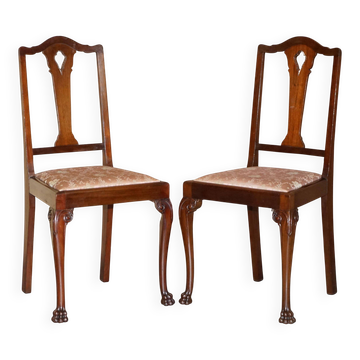 Pair of antique English chairs in hardwood with lion paw carved legs.