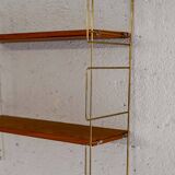 Wall-mounted shelf (Hylla) with brass structure