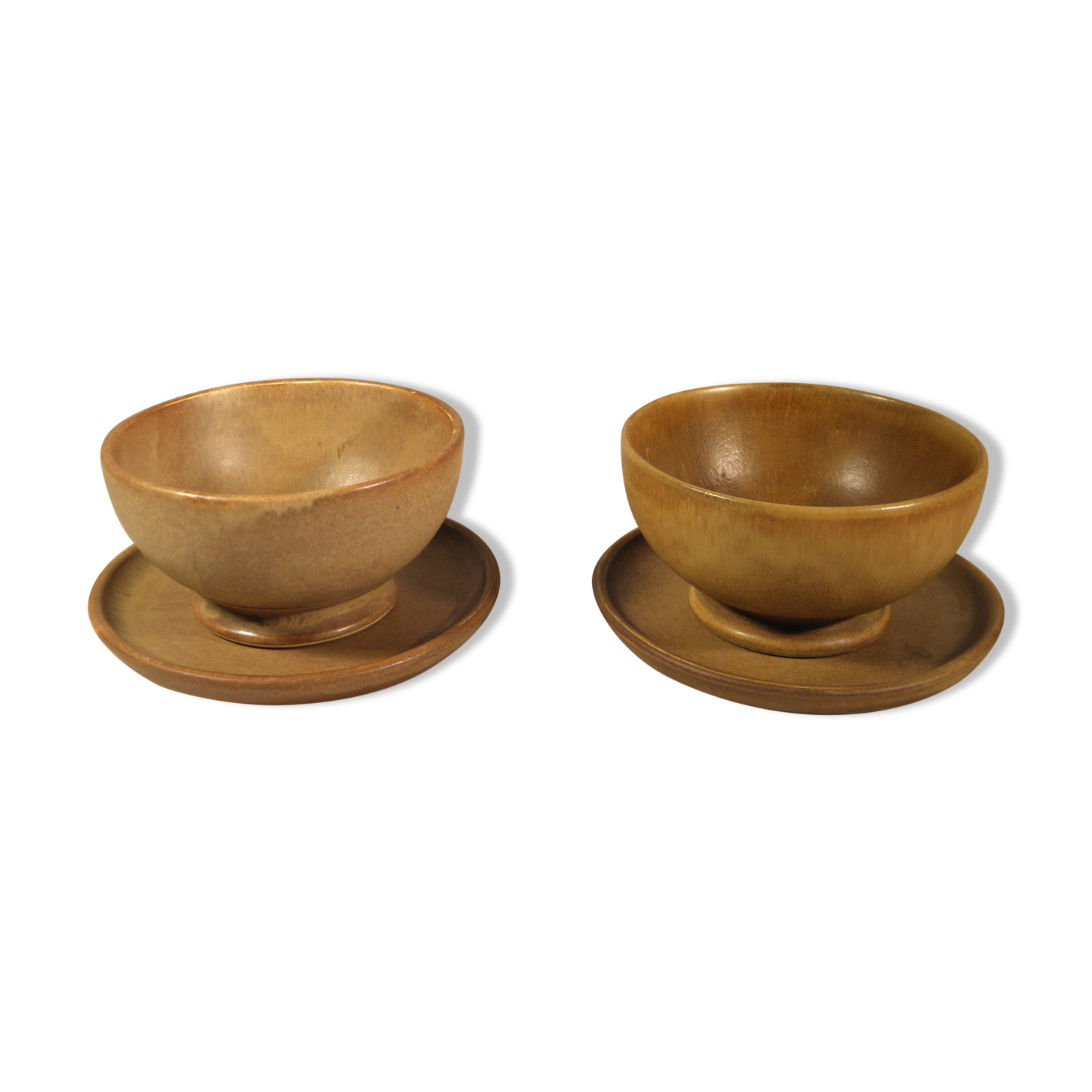 Two sandstone bowls and saucers