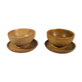 Two sandstone bowls and saucers