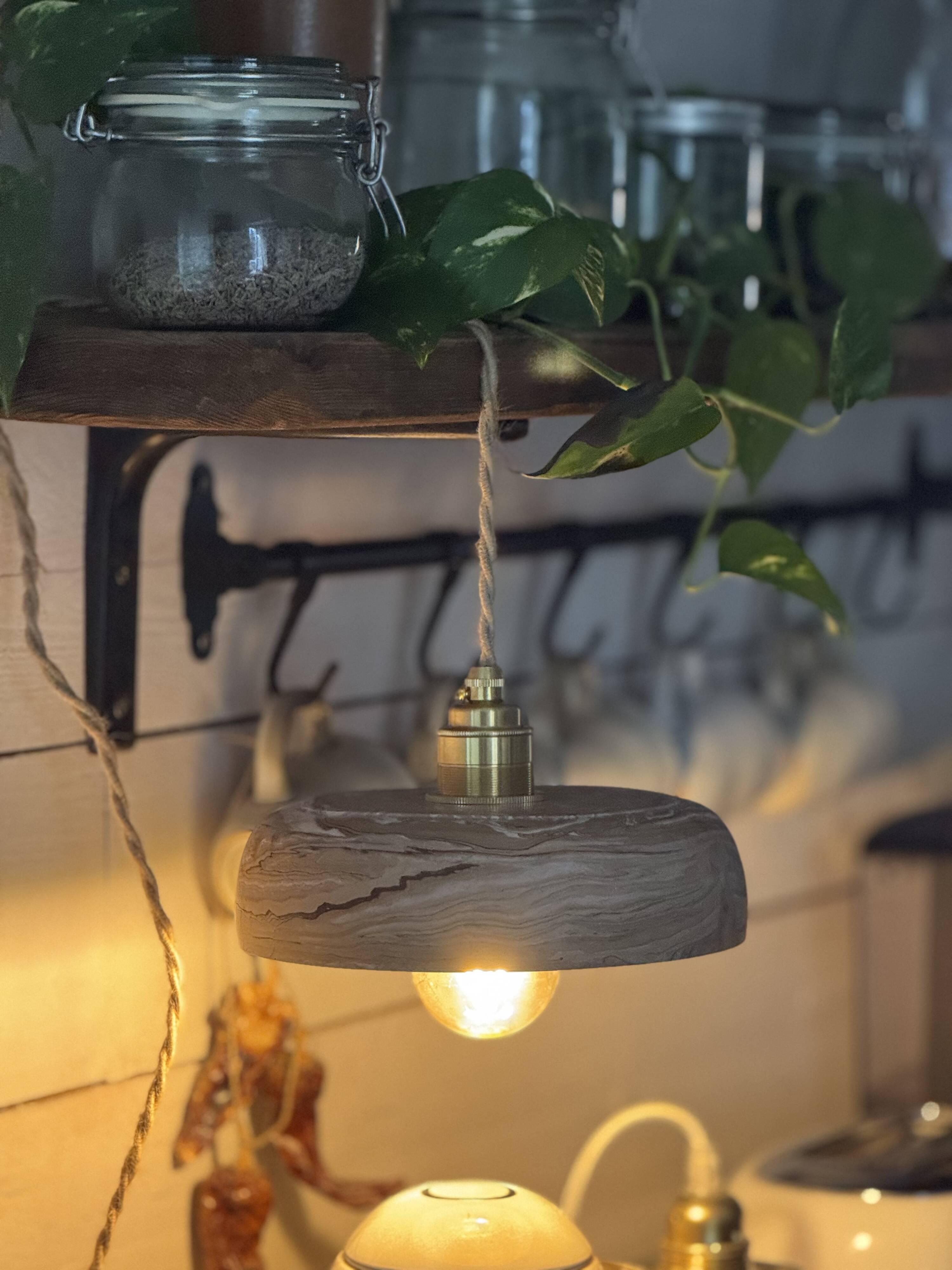 Handcrafted portable lamp with a marbled stone effect