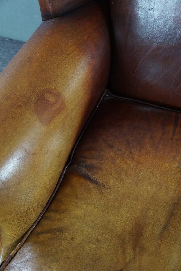 Armchair in patinated sheepskin leather