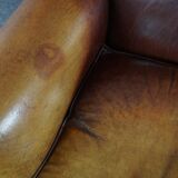 Armchair in patinated sheepskin leather