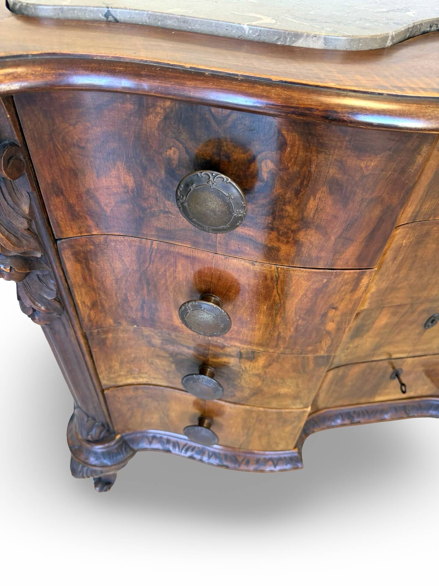 serpentine commode in antique walnut