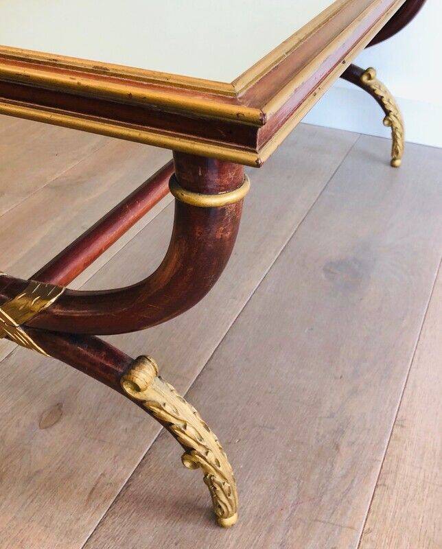 Patinated and gilded carved wooden coffee table. Hirch House.