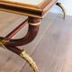 Patinated and gilded carved wooden coffee table. Hirch House.