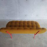 Upholstered bench with tufting