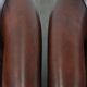 Set of two cow leather club armchairs in a luxurious red/brown colour