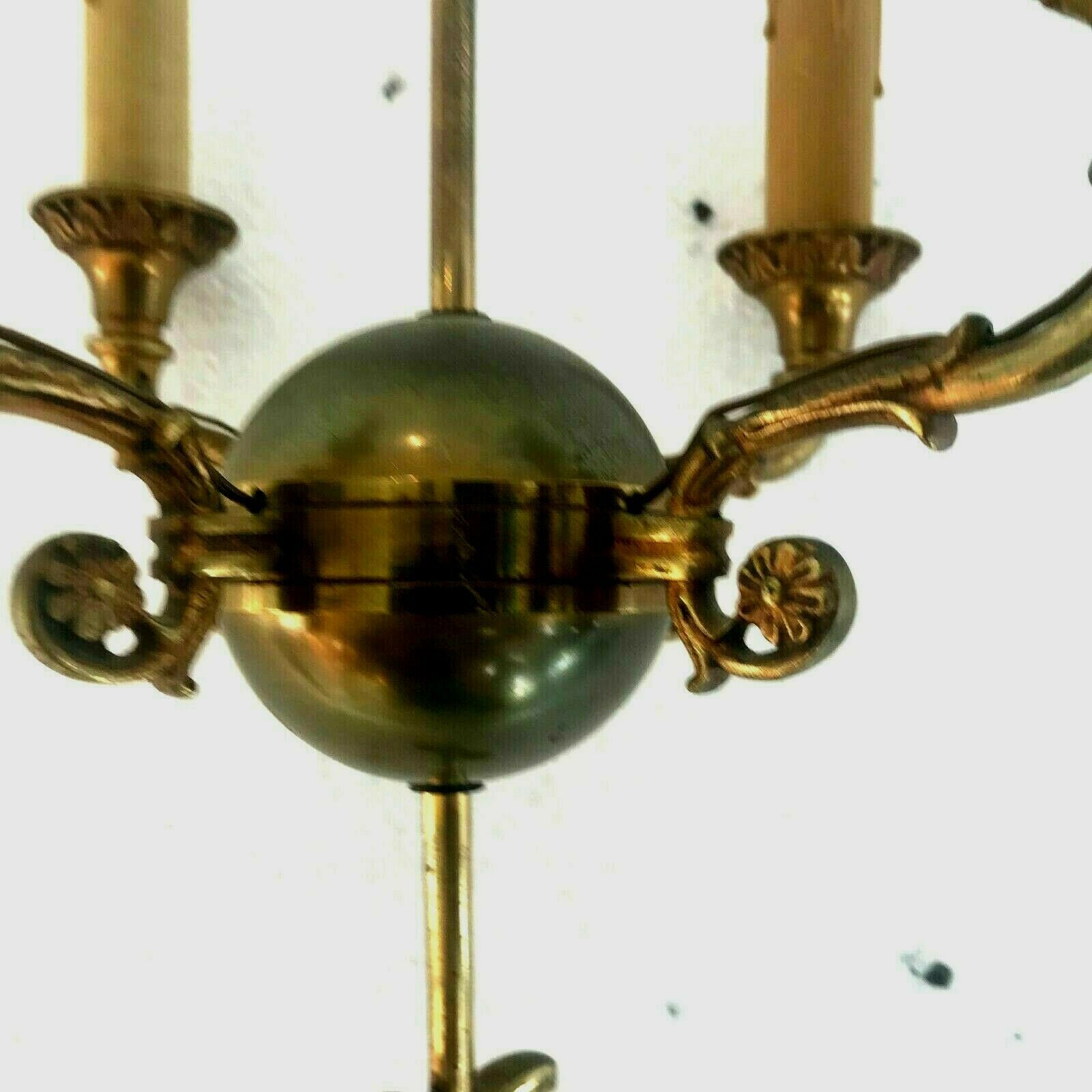 Empire-style chandelier has double patina