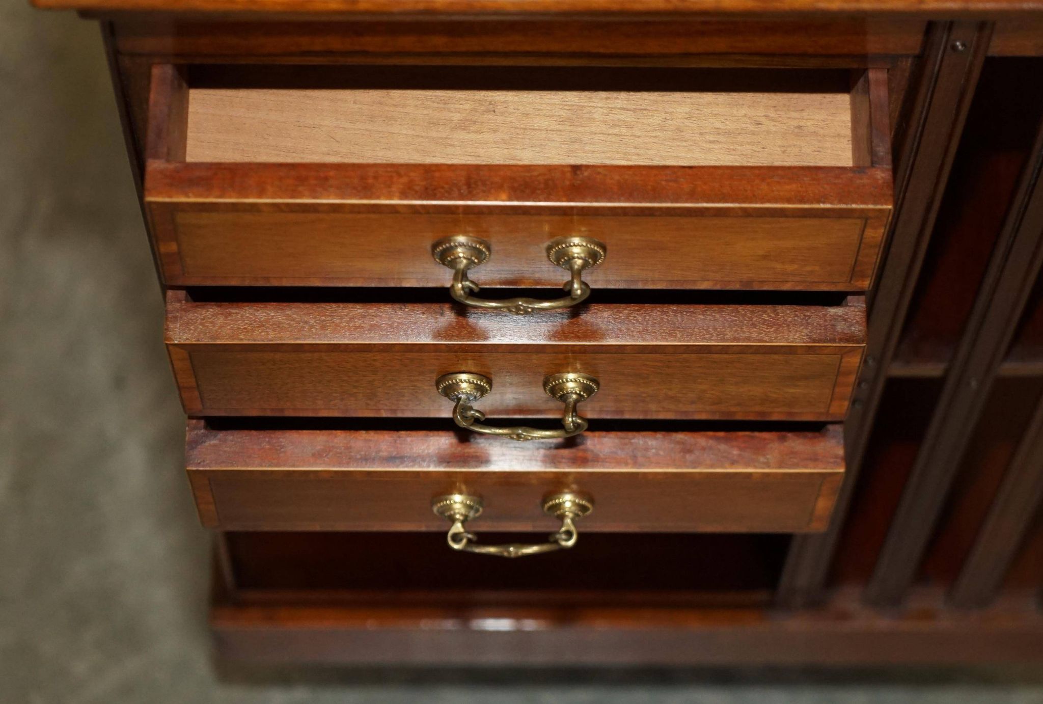 Restored Victorian walnut revolving library.