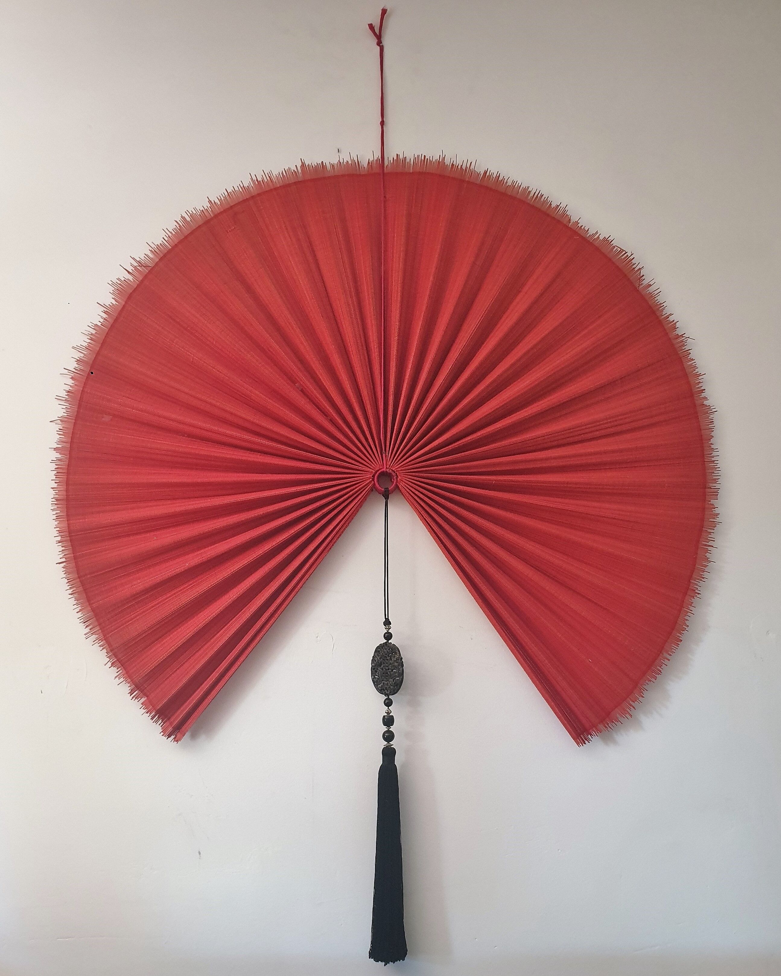 Chinese fan with decorative tassel