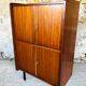 Storage cabinet with double compartment, metal feet circa 60's
