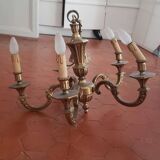 Large old chandelier in gilded brass